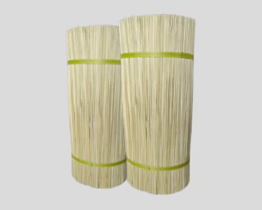 Two stacks of bamboo sticks wrapped in green tape, positioned side by side against a neutral background.