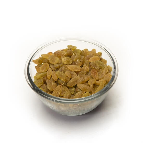 A bowl filled with plump raisins against a white background, showcasing their rich brown color and texture.
